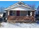 Charming bungalow with brick facade and red front door at 431 N 18Th Ave, Beech Grove, IN 46107