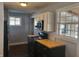 Modern kitchen with black cabinets and wood countertops at 431 N 18Th Ave, Beech Grove, IN 46107