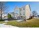 Two-story house with beige siding, screened porch, and landscaping at 4348 Princeton Park Dr, Columbus, IN 47201