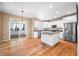 Bright kitchen with white cabinets, granite counters, and hardwood floors at 4348 Princeton Park Dr, Columbus, IN 47201