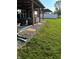 Spacious backyard with a covered patio and comfortable seating, creating an inviting outdoor space at 4543 W Meadows Ln, New Palestine, IN 46163
