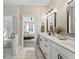 Spa-like bathroom with double vanity and a large marble shower at 4543 W Meadows Ln, New Palestine, IN 46163