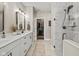 Elegant bathroom with double vanity, marble shower, and walk-in closet at 4543 W Meadows Ln, New Palestine, IN 46163