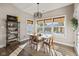 Charming breakfast nook with window seating and a mid-century modern table set at 4543 W Meadows Ln, New Palestine, IN 46163