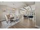 Open concept dining room with hardwood floors and views to the living room at 4543 W Meadows Ln, New Palestine, IN 46163