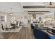 Open concept dining room features hardwood floors and a large farmhouse table at 4543 W Meadows Ln, New Palestine, IN 46163