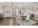 Elegant dining room with hardwood floors, chandelier, and antique buffet at 4543 W Meadows Ln, New Palestine, IN 46163