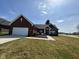 Charming brick ranch home with a manicured lawn and inviting entryway at 4543 W Meadows Ln, New Palestine, IN 46163