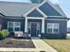 Inviting front entrance with a decorative wreath and charming bench seating at 4543 W Meadows Ln, New Palestine, IN 46163
