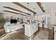 Modern kitchen with white cabinets, stainless steel appliances, and island at 4543 W Meadows Ln, New Palestine, IN 46163