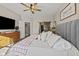 Relaxing main bedroom featuring a large bed, wood dresser and sliding barn door at 4543 W Meadows Ln, New Palestine, IN 46163