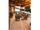 Outdoor patio featuring comfortable seating, string lights, and ceiling fan for relaxed gatherings at 4543 W Meadows Ln, New Palestine, IN 46163