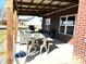 Relaxing patio area featuring a dining table and comfortable seating arrangement, perfect for outdoor gatherings at 4543 W Meadows Ln, New Palestine, IN 46163