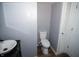 Small bathroom with toilet and pedestal sink at 460 Park Pl, Martinsville, IN 46151