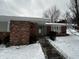 Front entrance with brick and siding at 460 Park Pl, Martinsville, IN 46151