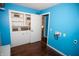 Laundry room with built-in shelving and blue walls at 460 Park Pl, Martinsville, IN 46151