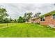 Large backyard, grassy area, deck, and shed at 4657 E 62Nd St, Indianapolis, IN 46220