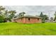 Spacious backyard with lush lawn and brick home at 4657 E 62Nd St, Indianapolis, IN 46220