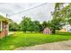 Large backyard with shed and partial home view at 4657 E 62Nd St, Indianapolis, IN 46220