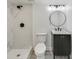 Modern basement bathroom with a shower and floating vanity at 4657 E 62Nd St, Indianapolis, IN 46220