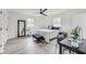 Spacious bedroom with hardwood floors, ample natural light, and a work area at 4657 E 62Nd St, Indianapolis, IN 46220