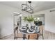 Modern dining room with a round table and views into the living room and kitchen at 4657 E 62Nd St, Indianapolis, IN 46220