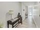 Clean and bright hallway with modern flooring and a console table at 4657 E 62Nd St, Indianapolis, IN 46220