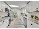 Updated kitchen boasts granite countertops, stainless steel appliances, and white shaker cabinets at 4657 E 62Nd St, Indianapolis, IN 46220