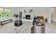 Cozy living room with hardwood floors, a fireplace, and plenty of natural light at 4657 E 62Nd St, Indianapolis, IN 46220