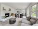 Spacious living room showcasing a fireplace, hardwood floors and an open floorplan at 4657 E 62Nd St, Indianapolis, IN 46220