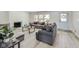 Modern living room with gray sofas and light flooring at 4657 E 62Nd St, Indianapolis, IN 46220