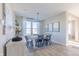 Spacious dining area with large windows, chandelier, and artwork at 4730 E Shadowbrook Dr, Camby, IN 46113