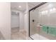 Modern bathroom with a large walk-in shower and neutral tile at 4751 E Shadowbrook Dr, Camby, IN 46113