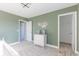 Bedroom with a crib, dresser, and access to a closet at 4751 E Shadowbrook Dr, Camby, IN 46113