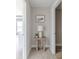 Neutral colored hallway with a small table and artwork at 4751 E Shadowbrook Dr, Camby, IN 46113