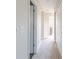 Bright hallway with carpeted flooring and access to bedrooms at 4751 E Shadowbrook Dr, Camby, IN 46113