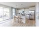 Modern kitchen with white cabinets, stainless steel appliances, and island at 4751 E Shadowbrook Dr, Camby, IN 46113