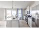 Modern kitchen features stainless steel appliances and an island at 4751 E Shadowbrook Dr, Camby, IN 46113