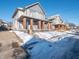 Two-story duplex with driveway and snowy yard at 512 E 33Rd St, Indianapolis, IN 46205