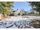 Backyard view of home with snowy yard at 5202 Woodside Dr, Indianapolis, IN 46228