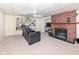 Finished basement with a fireplace and reclining chairs at 5202 Woodside Dr, Indianapolis, IN 46228