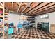 Unfinished basement with shelving and storage at 5202 Woodside Dr, Indianapolis, IN 46228