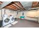 Unfinished basement with laundry hookups and ample storage space at 5202 Woodside Dr, Indianapolis, IN 46228