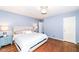 Light and airy bedroom with hardwood floors and a king-size bed at 5202 Woodside Dr, Indianapolis, IN 46228