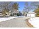 Gray house with two-car garage and gravel driveway at 5202 Woodside Dr, Indianapolis, IN 46228