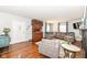 Living room with hardwood floors, fireplace, and comfortable seating at 5202 Woodside Dr, Indianapolis, IN 46228