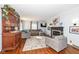 Living room with hardwood floors, fireplace, and comfortable seating at 5202 Woodside Dr, Indianapolis, IN 46228