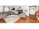 Spacious living room with hardwood floors, fireplace, and comfortable seating at 5202 Woodside Dr, Indianapolis, IN 46228