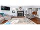 Living room with hardwood floors, fireplace, and comfortable seating at 5202 Woodside Dr, Indianapolis, IN 46228