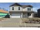 Two-story home with a two-car garage, gray siding, and a concrete driveway at 5209 Cartland Dr, Indianapolis, IN 46239